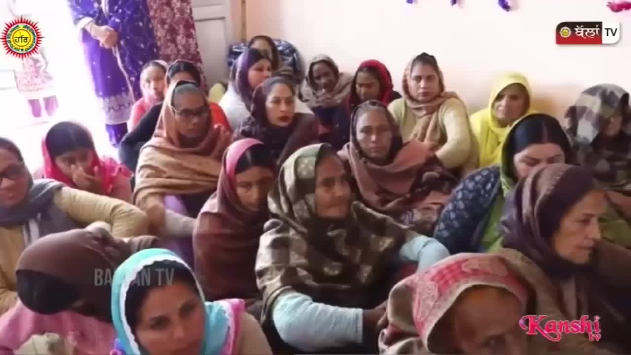 A group of women are gathered, some with heads bowed in prayer. A Kanshi TV logo is visible in the corner.