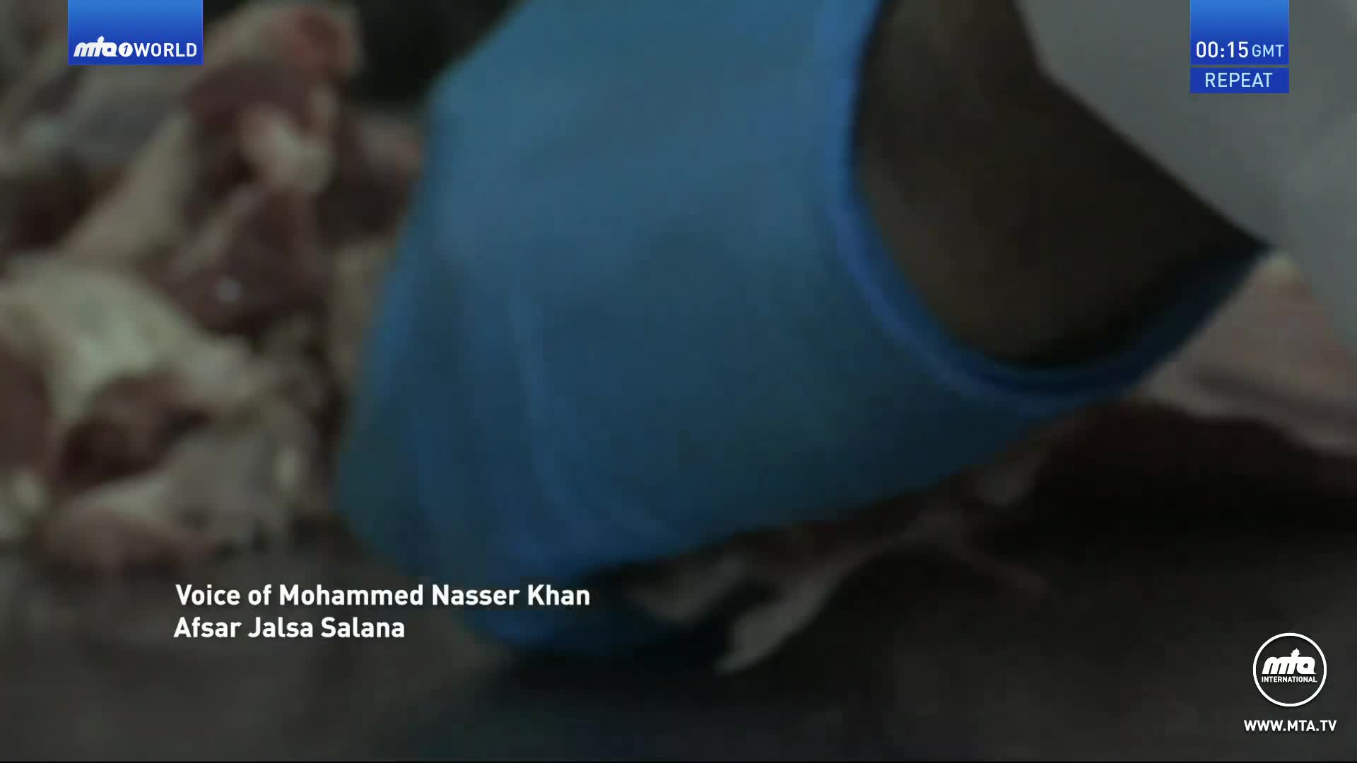 A gloved hand, clad in blue, is working with raw meat. The scene is likely from the United Kingdom, broadcast on MTA1 World.
