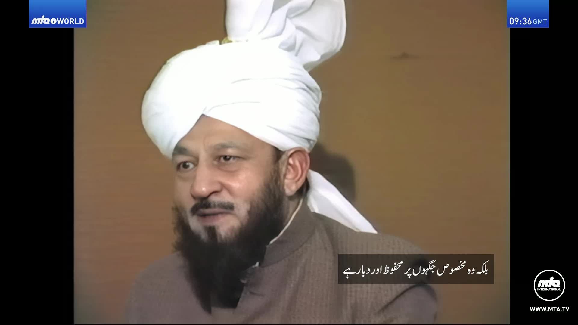 A man with a white turban and a beard looks to his left. The MTA World logo appears in the top left corner.