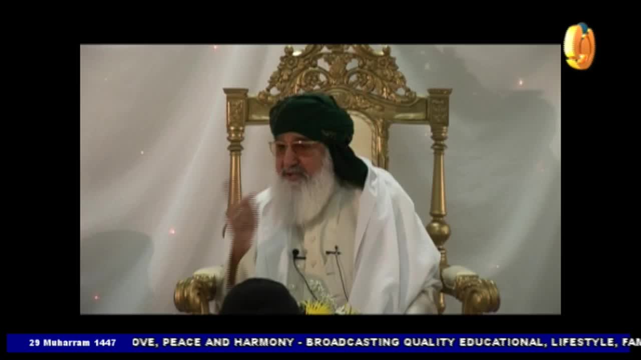A man in a green turban gestures with his right hand while seated in an ornate chair. He's speaking, and the Noor TV logo is visible in the corner.
