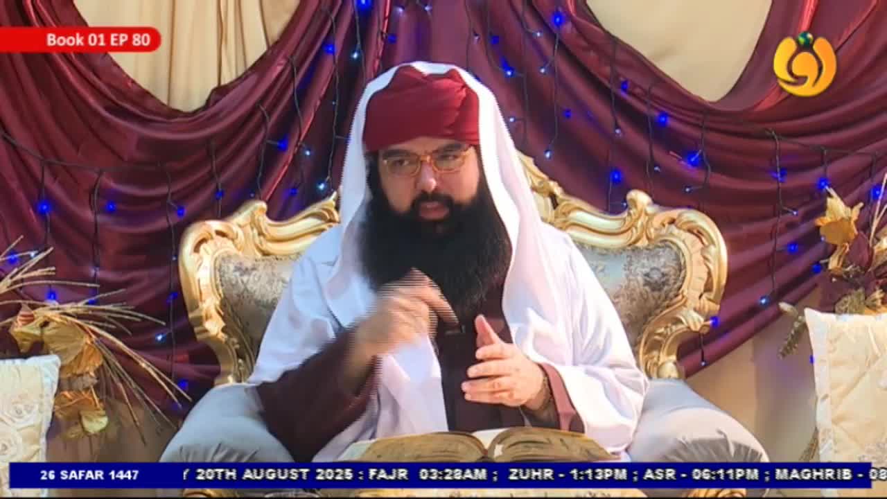 A man in a turban and glasses sits on a gilded chair, gesturing with his right hand as he speaks. The Noor TV logo is visible, and the date is displayed at the bottom of the screen.

