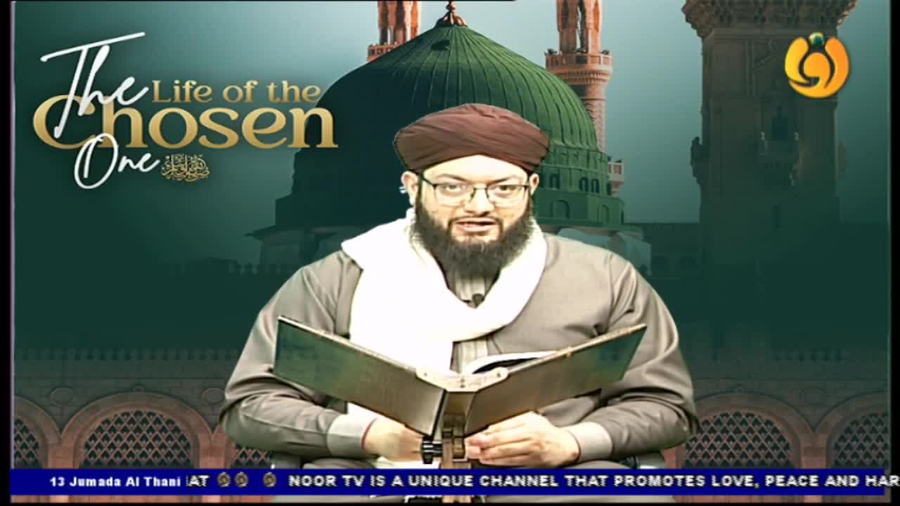 A man with a dark beard and glasses is speaking, holding an open book. Behind him, a green-domed structure and the words "Life of the Chosen One" are displayed on Noor TV.

