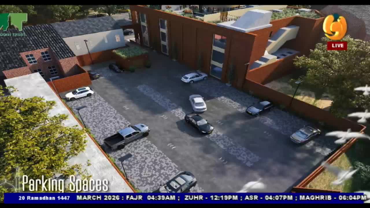 A silver pickup truck pulls into a parking spot. A white SUV is parked further down the lot.