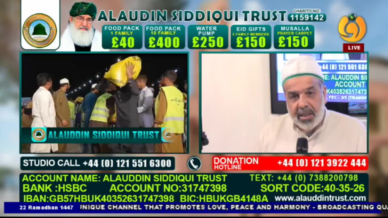 A man carries a large yellow bag over his shoulder, surrounded by others in what looks like a distribution effort. On a screen, a man in a white cap speaks into a microphone.