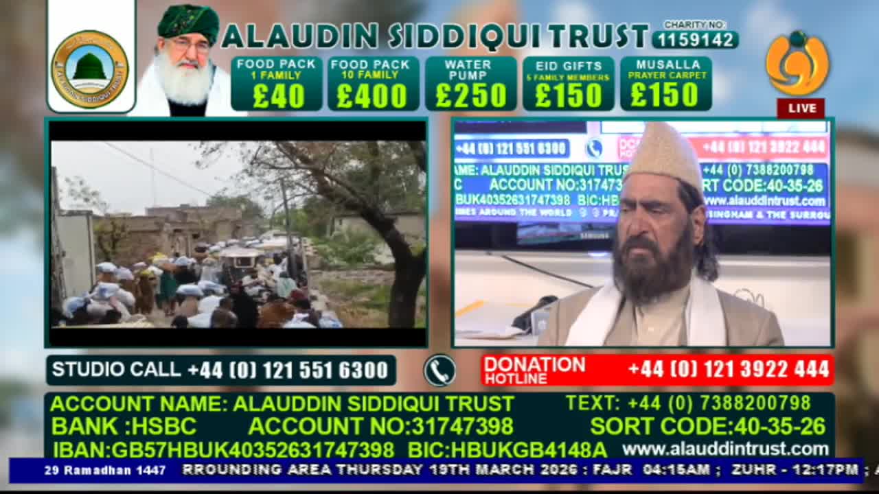 A crowd of people, many in white caps, are gathered in a dusty street, looking towards something out of frame. A man with a long grey beard, wearing a traditional cap and scarf, speaks on a screen, his gaze directed downwards. A crowd of people, many in white caps, are gathered in a dusty street, looking towards something out of frame. A man with a long grey beard, wearing a traditional cap and scarf, speaks on a screen, his gaze directed downwards.