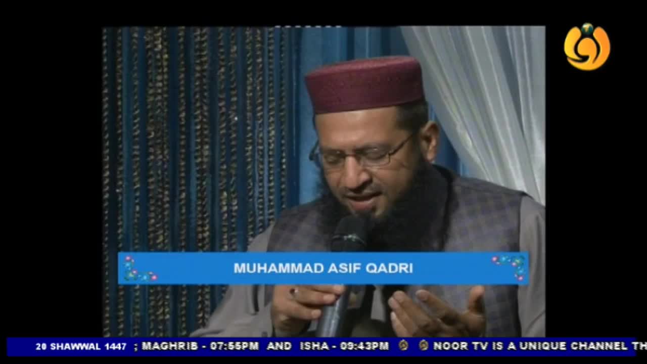 Muhammad Asif Qadri speaks into a microphone, his hands gesturing softly. The Noor TV logo is visible in the corner, and the date 28 Shawwal 1447 appears at the bottom. Muhammad Asif Qadri speaks into a microphone, his hands gesturing softly. The Noor TV logo is visible in the corner, and the date 28 Shawwal 1447 appears at the bottom.