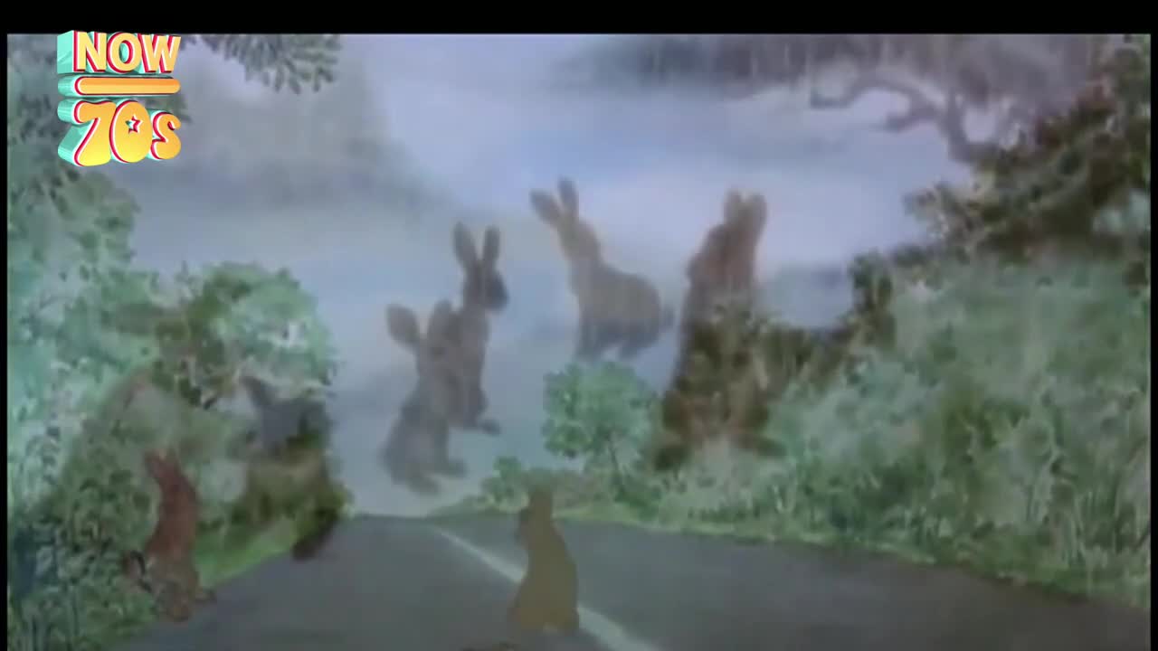 A group of rabbits, rendered in a hazy, dreamlike style, appear to be leaping along a road. The scene is set in a misty, rural environment, reminiscent of a children's story from the United Kingdom, a throwback to the 70s.
