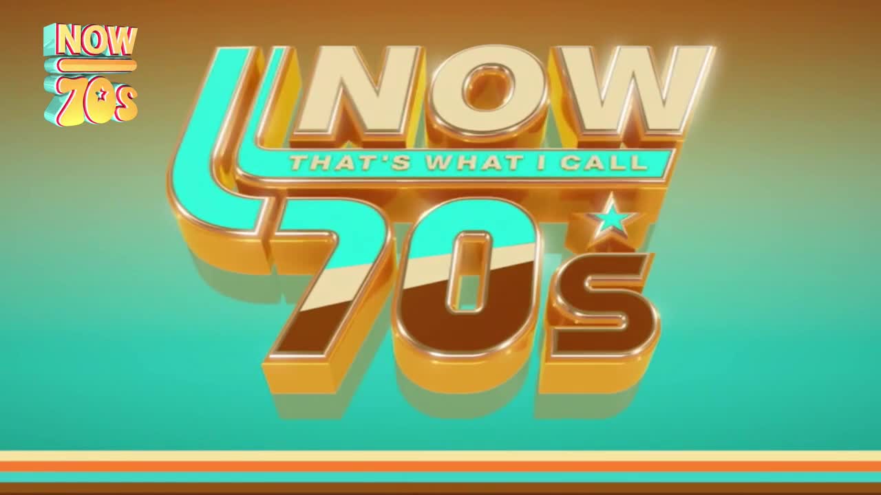 The words "NOW 70s" in a 3D-style font are set against a teal and orange background. The logo is bold and colourful, reminiscent of the UK's music scene from the decade.

