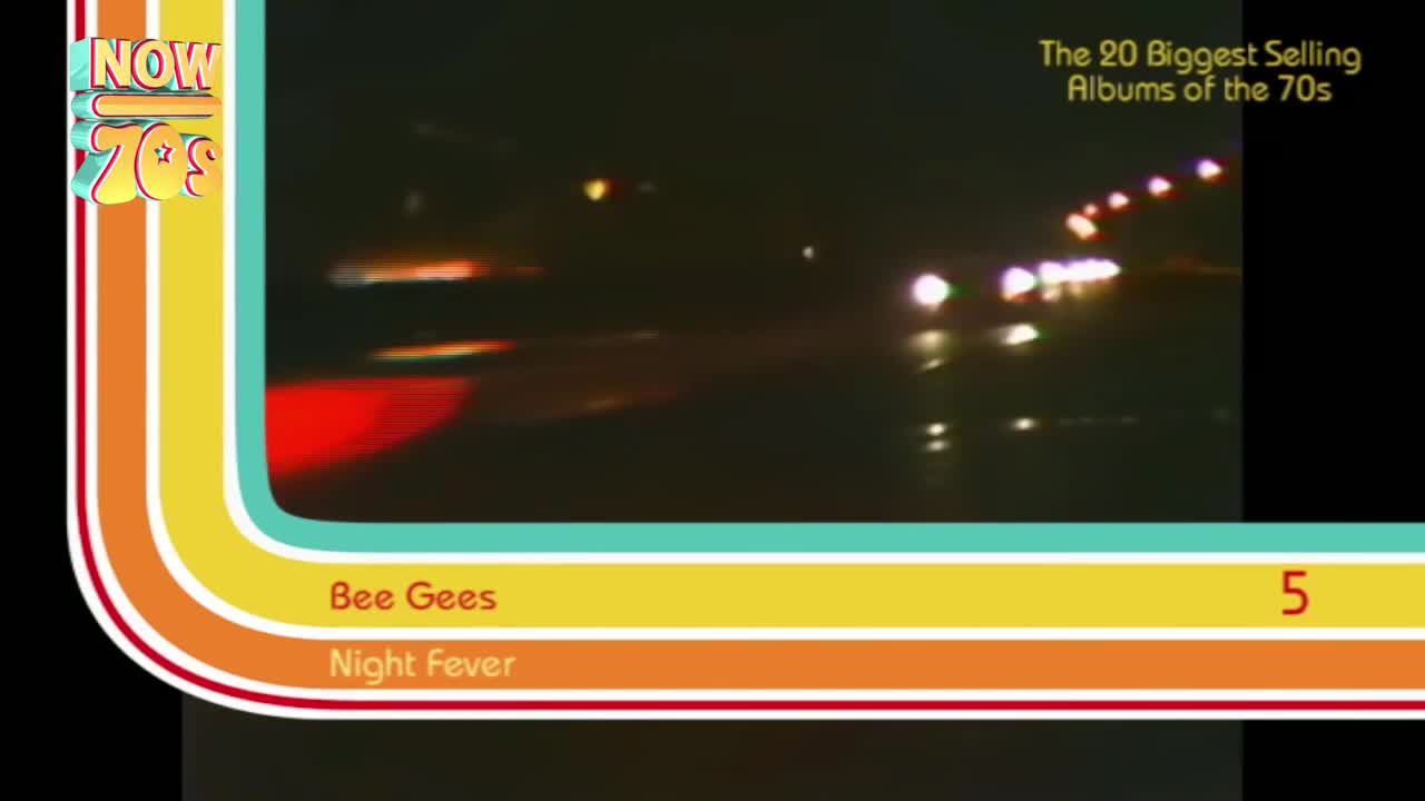 Headlights streak across the screen, their bright beams reflecting on the wet road. The Bee Gees' "Night Fever" is playing, and it's number five on the list of the biggest albums of the decade.
