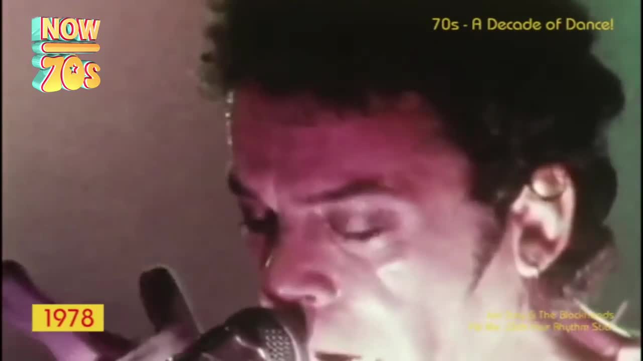 The singer holds the microphone close, his face illuminated with a pinkish glow. His eyes are closed as he belts out a tune, sweat glistening on his forehead.
The singer holds the microphone close, his face illuminated with a pinkish glow. His eyes are closed as he belts out a tune, sweat glistening on his forehead.