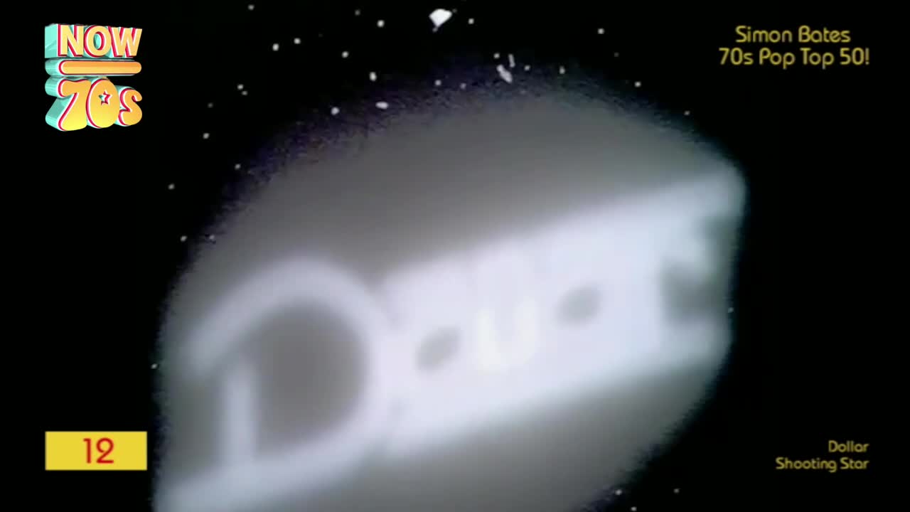 A large, luminous "DOLLAR" sign arcs across the blackness, its white letters softly glowing. Tiny white specks, like distant stars, pepper the background as the song "Shooting Star" plays.
