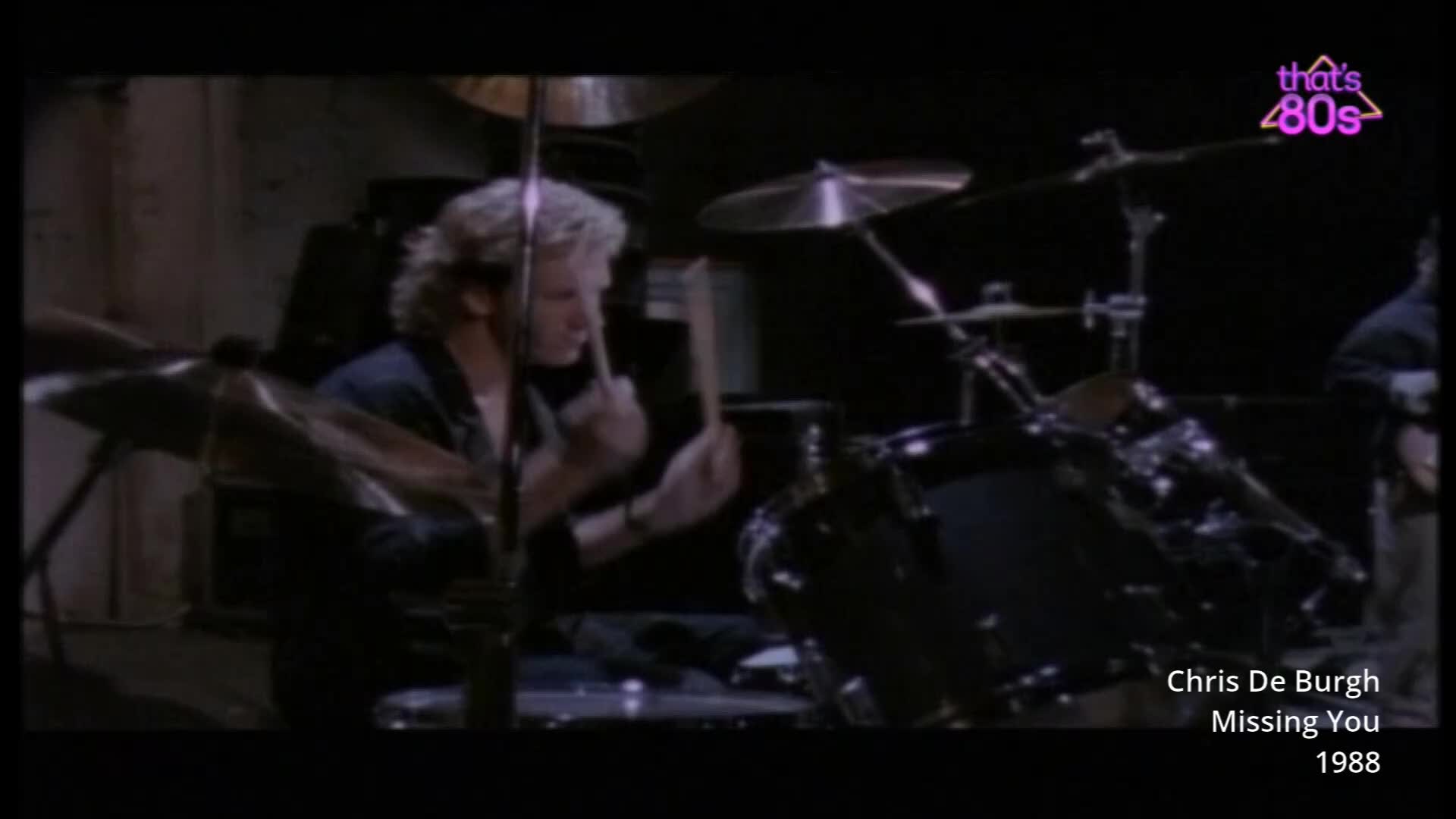 The drummer's sticks are a blur as he pounds out a rhythm on his kit. His blonde hair is tousled, and he's leaning into the beat. The drummer's sticks are a blur as he pounds out a rhythm on his kit. His blonde hair is tousled, and he's leaning into the beat.