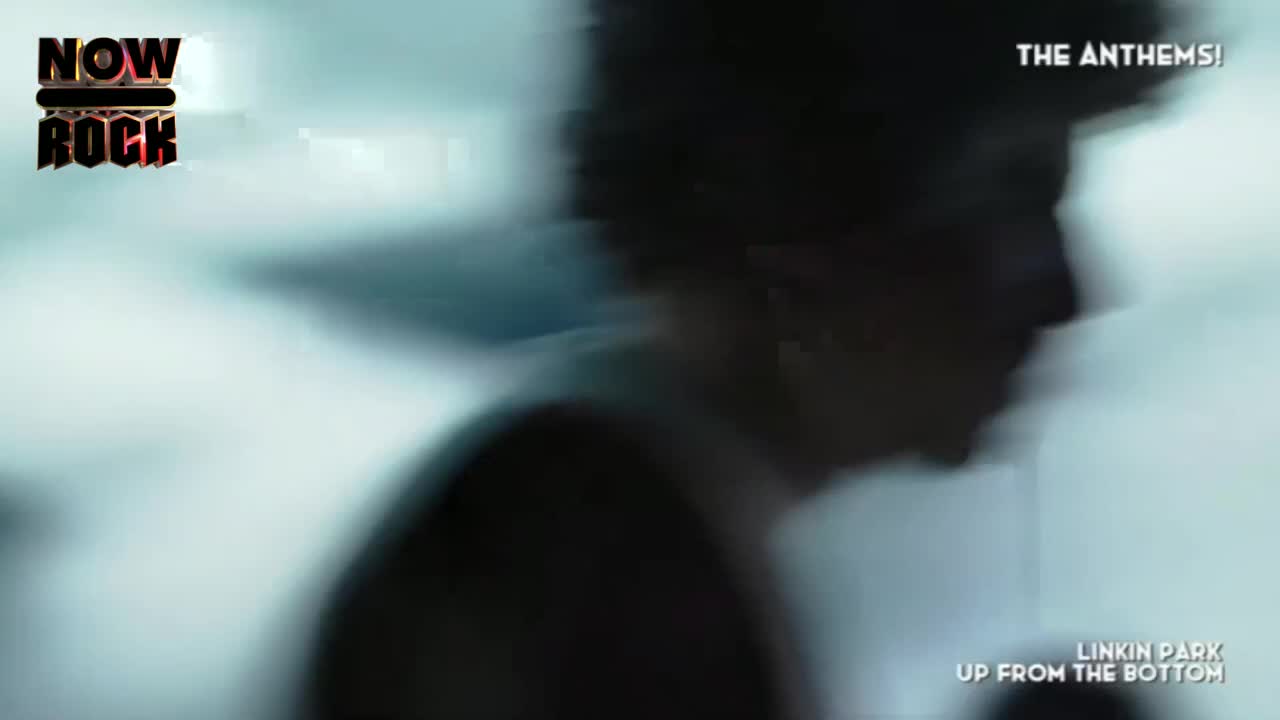 A silhouette of a person moves quickly across the screen, their face obscured by the blur. The NOW Rock logo and song title flash, highlighting the UK music scene.
