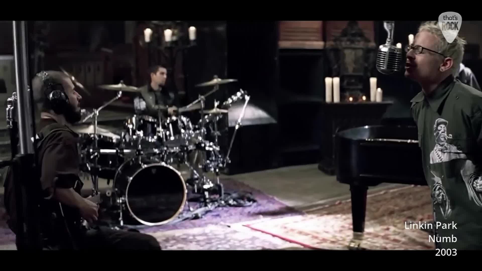 The singer belts into the microphone, his voice raw and powerful. Behind him, the drummer pounds out a steady rhythm, his sticks a blur against the cymbals.