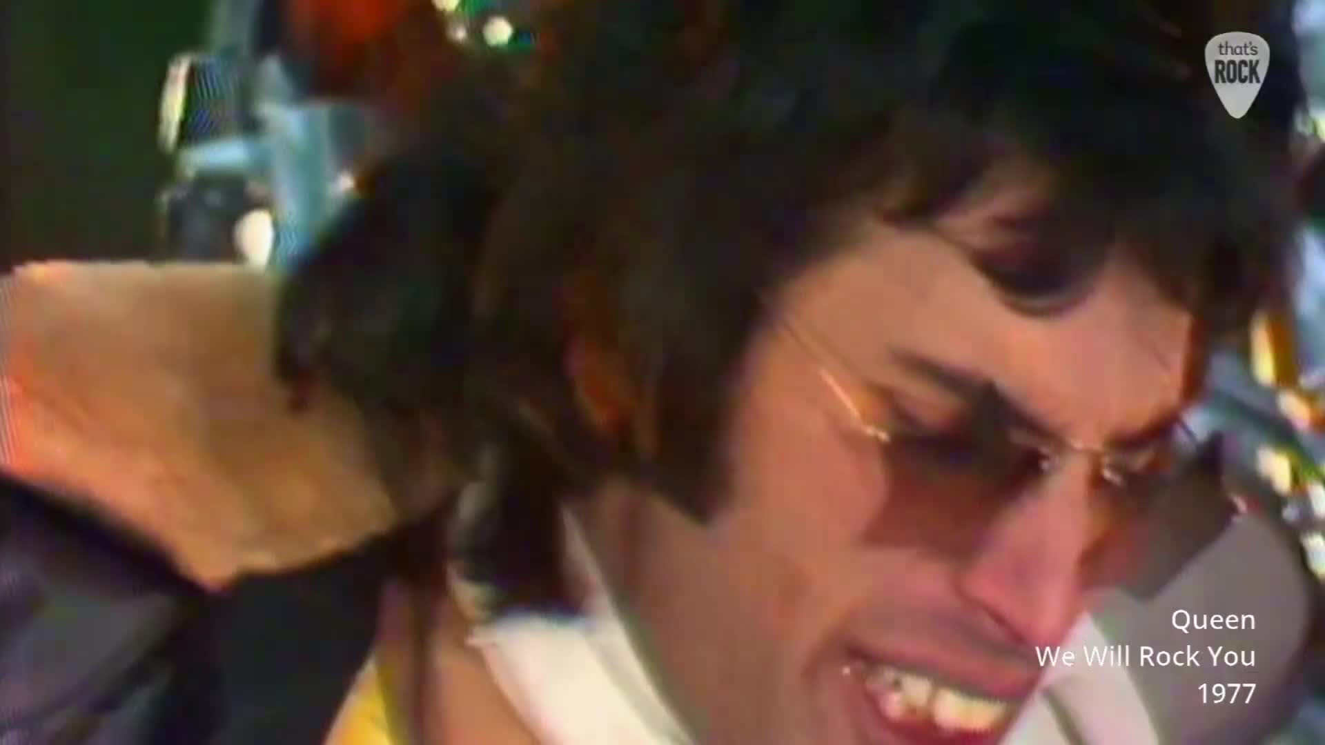 Freddie Mercury belts out lyrics, his face contorted with raw energy. The crowd roars back, a wave of anticipation for the anthem. Freddie Mercury belts out lyrics, his face contorted with raw energy. The crowd roars back, a wave of anticipation for the anthem.