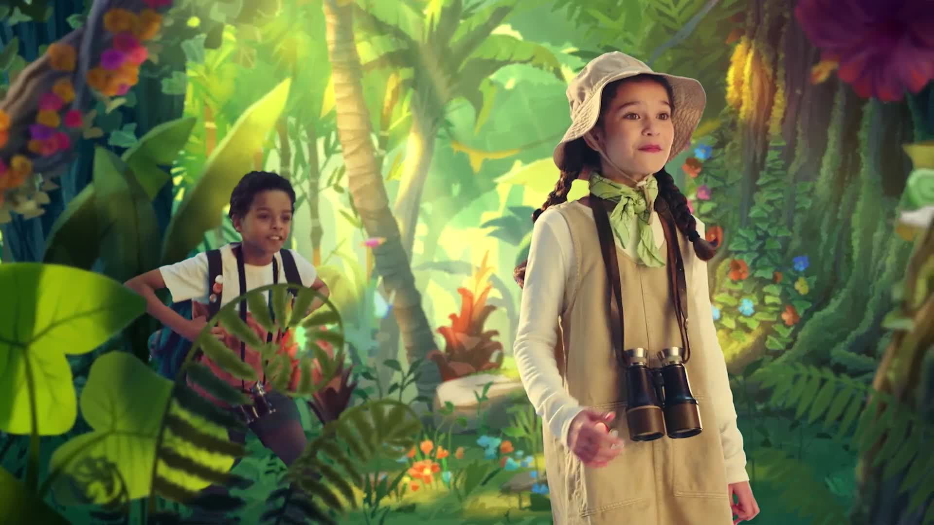 A girl in a safari outfit looks ahead, binoculars hanging from her neck. A boy, also in explorer gear, is behind her, grinning among the lush, painted foliage.
