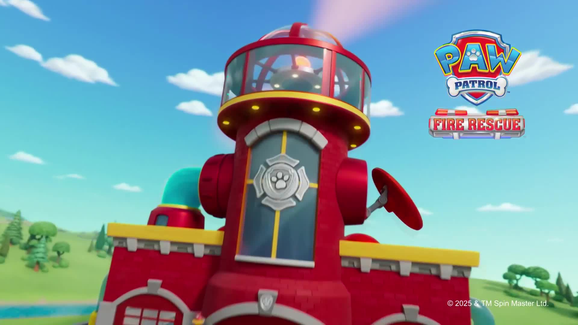A bright red fire station, topped with a glass tower, stands against a blue sky. A beam of light shines from the top, and the Paw Patrol logo is visible nearby.

