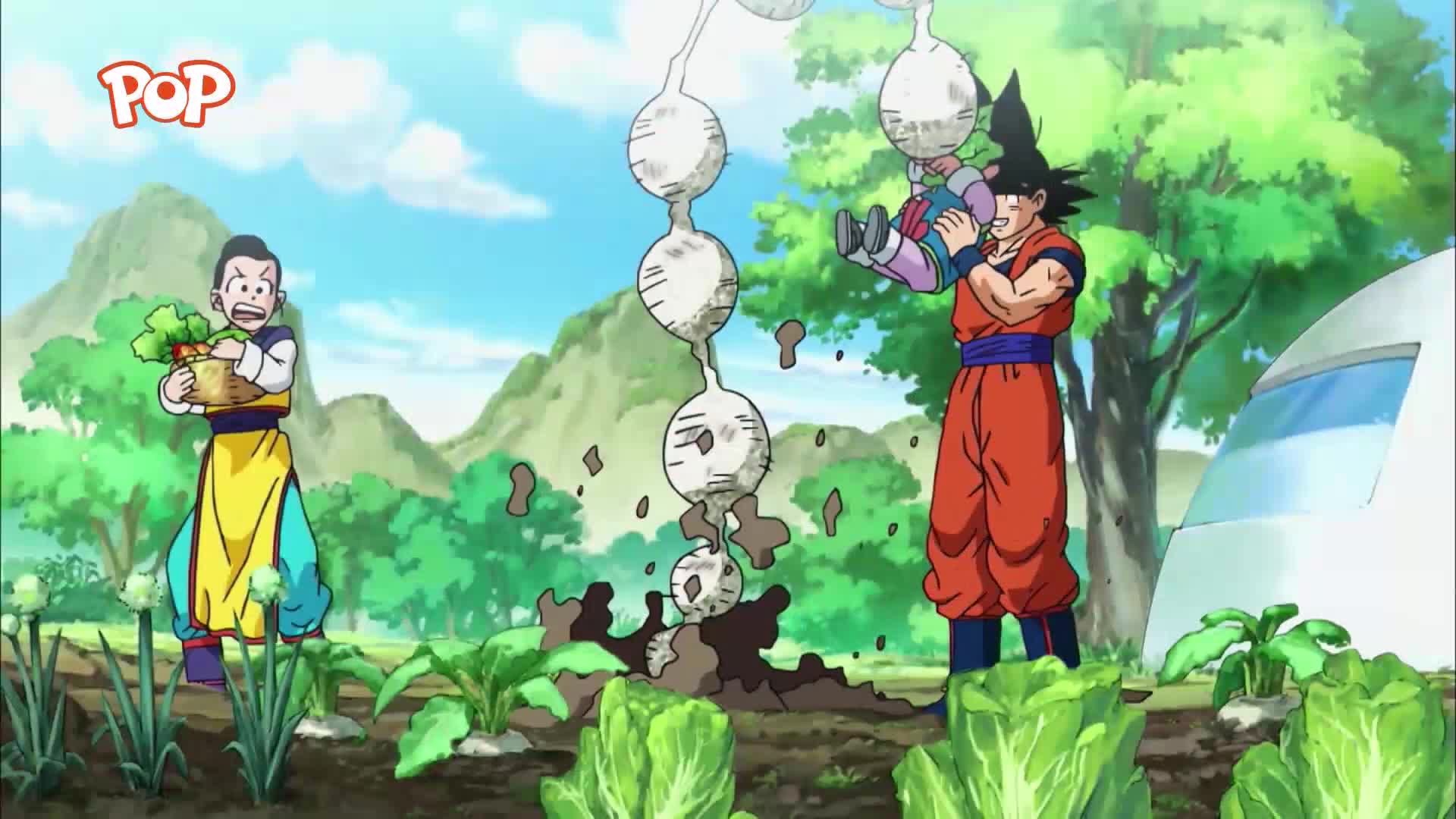 Goku laughs as he hoists a baby into the air, while a string of freshly pulled turnips tumbles from the earth. Chi-Chi, with a basket of vegetables, watches them from a nearby vegetable patch.
