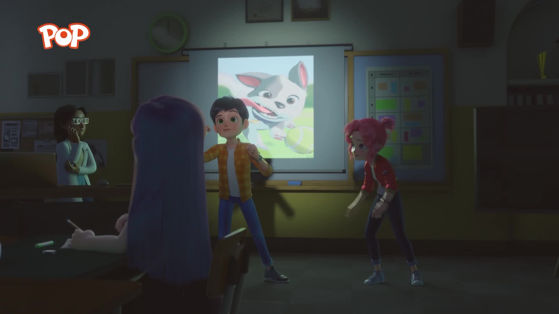 A boy in a yellow shirt and blue trousers stands with his arms outstretched, facing a projected image of a cartoon dog. A girl with pink hair, wearing a red jacket, crouches beside him.