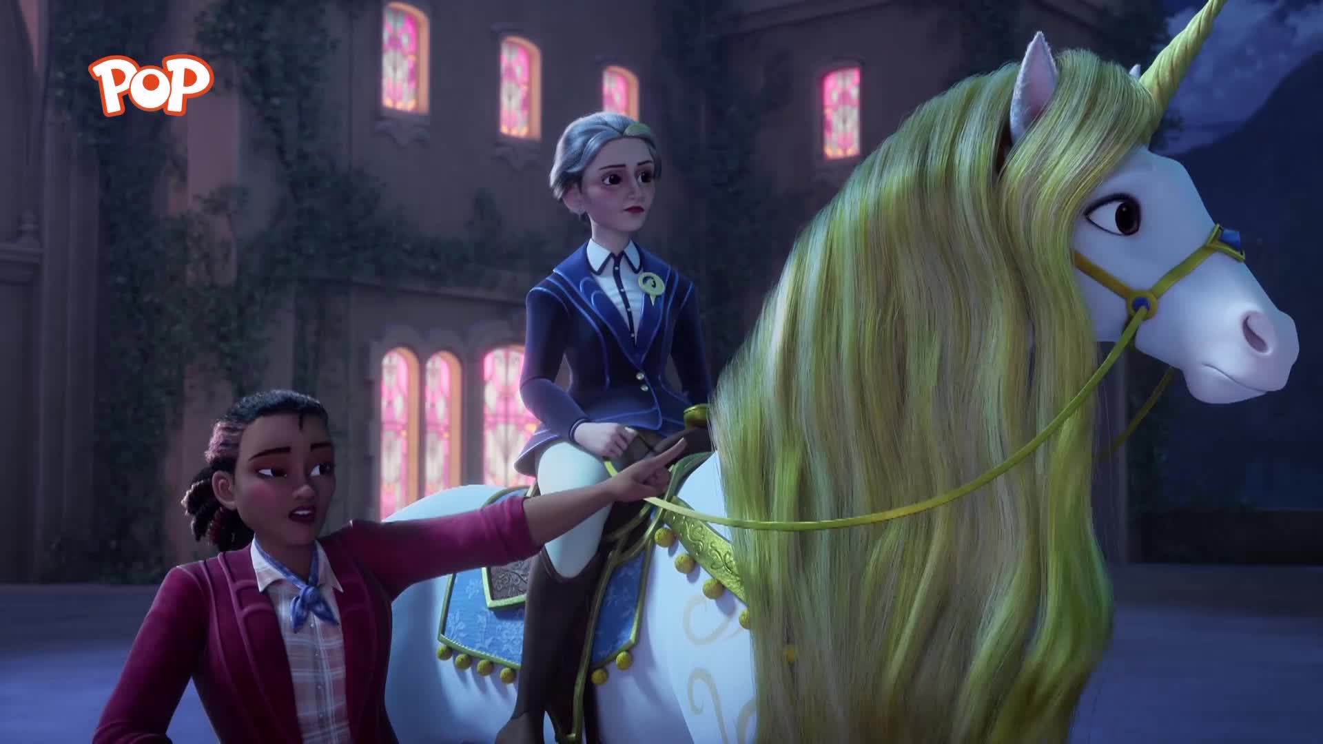 A young woman in a dark blue blazer and white shirt is perched atop a magnificent white unicorn, its long, flowing mane a pale gold. Another girl, in a maroon jacket and plaid shirt, steadies the unicorn's reins, her expression earnest.