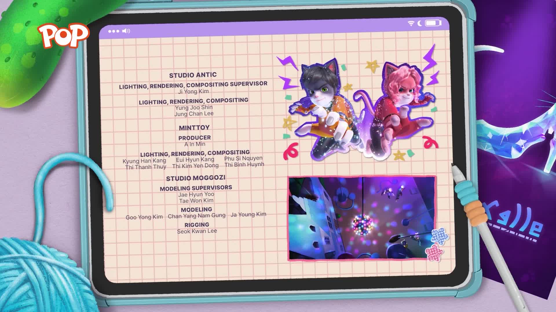 Two animated cats, one with black fur and the other with pink, are poised mid-air with lightning bolts around them. Below them, a small video displays a disco ball sparkling in a dimly lit room.