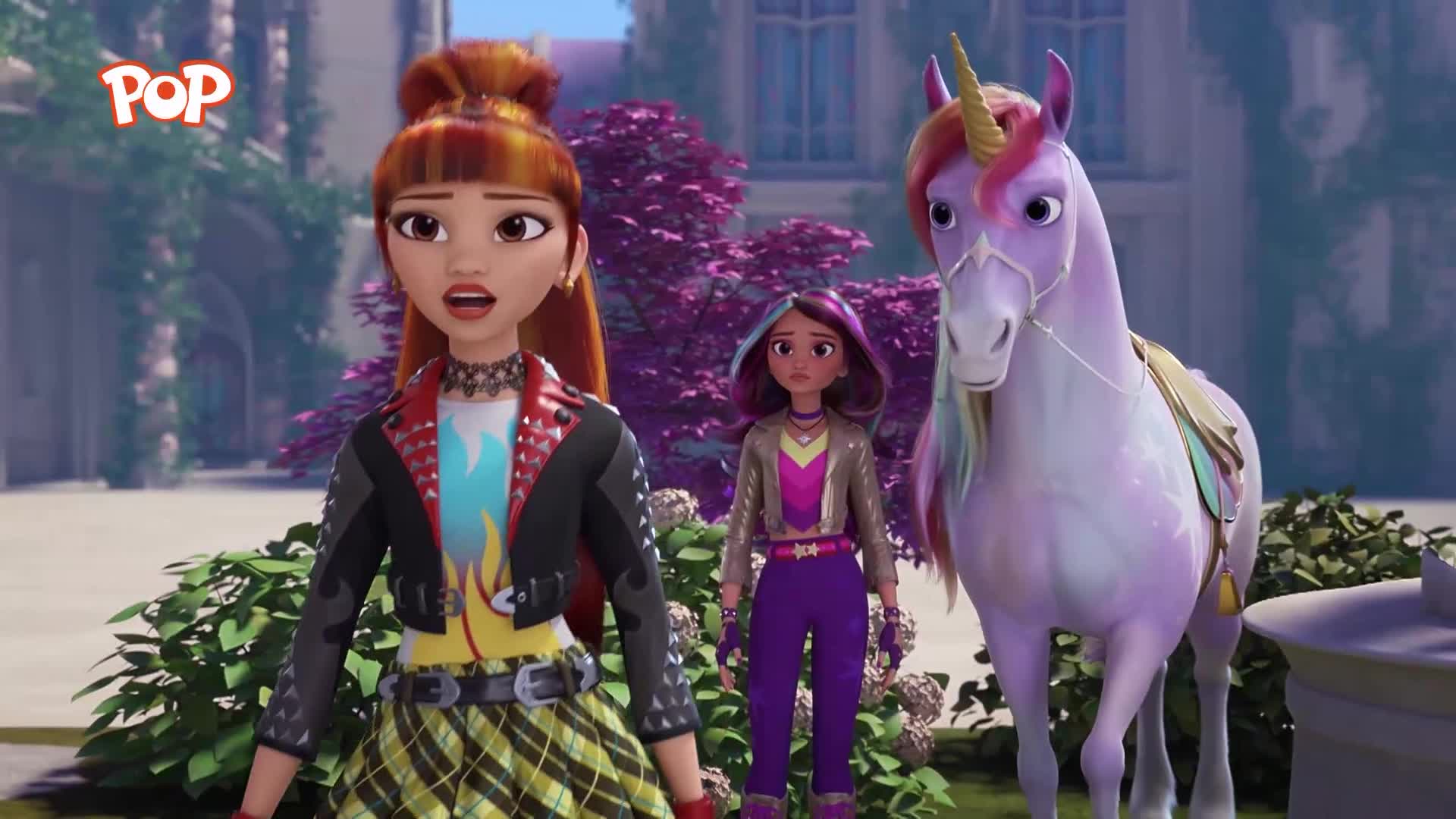 A girl with bright red hair and a studded jacket stands next to a unicorn with a rainbow mane. Another girl, with purple streaks in her hair, stands between them. A girl with bright red hair and a studded jacket stands next to a unicorn with a rainbow mane. Another girl, with purple streaks in her hair, stands between them.