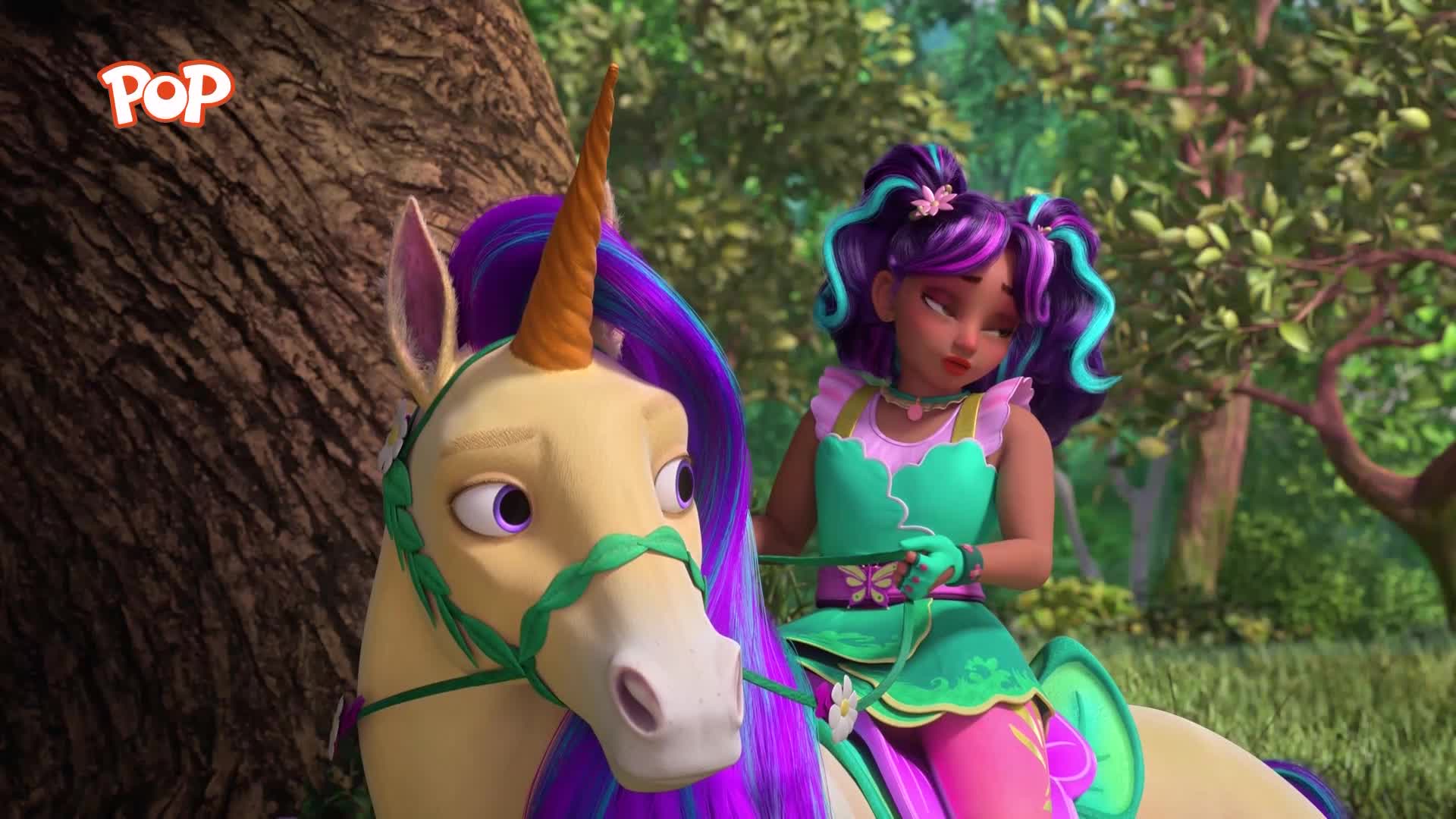A girl with purple hair rides a pale yellow unicorn through a sun-dappled forest. The unicorn's mane and tail are a vibrant mix of purple and blue, matching the girl's outfit.