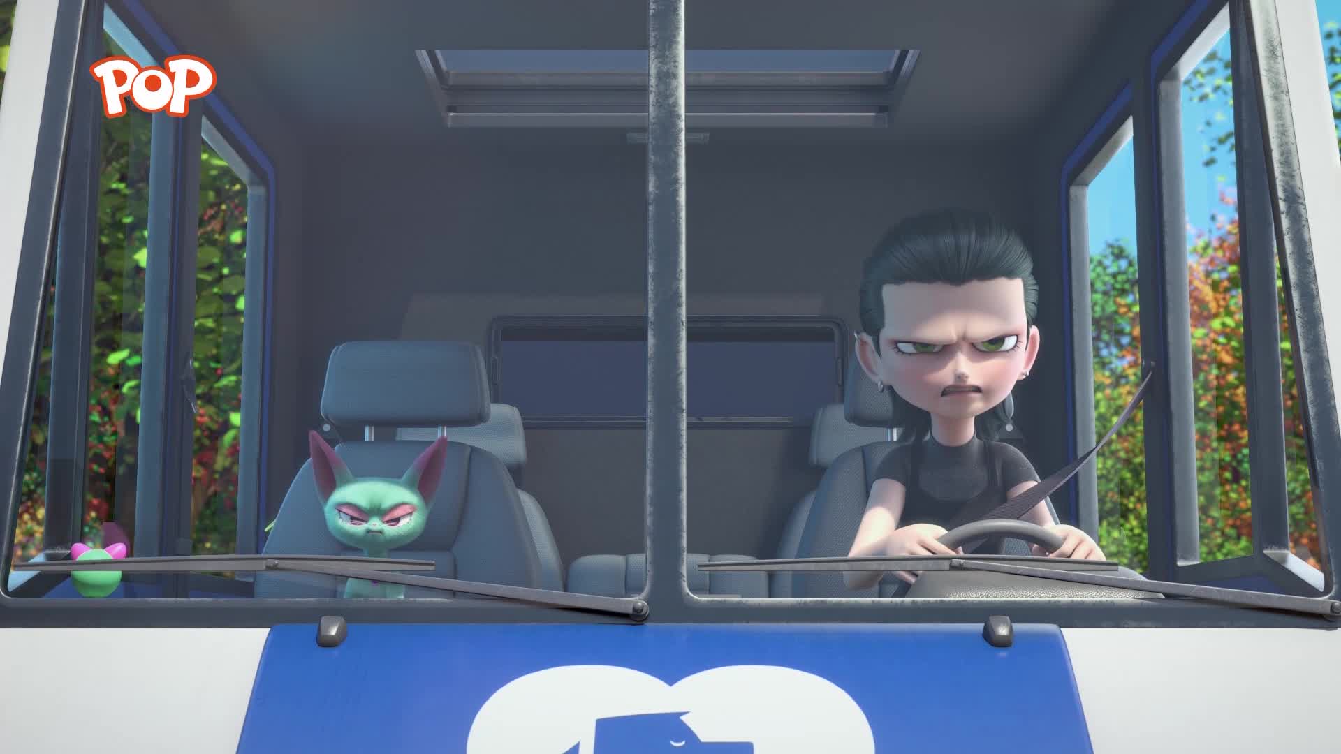 A young person with dark hair grips the steering wheel, their face set in a determined frown. Beside them, a green creature with large ears leans forward, its mouth agape in a silent shout.