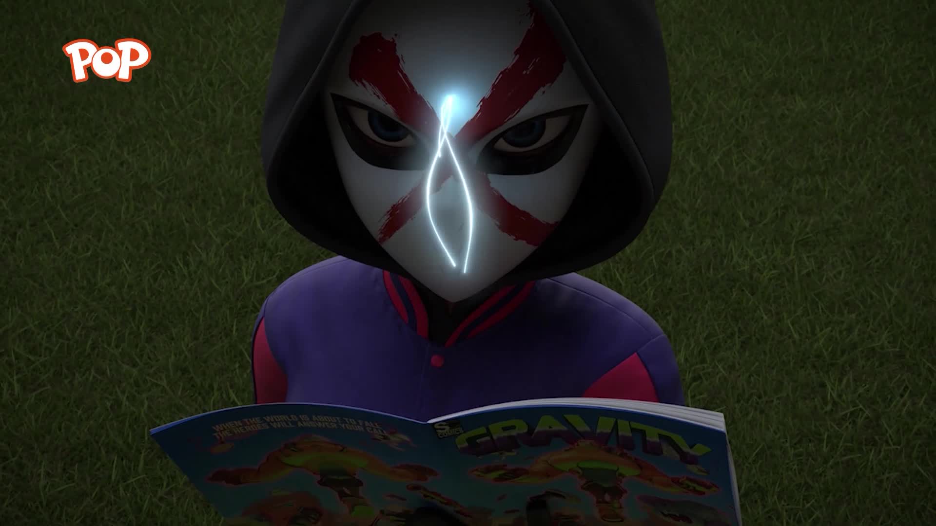 A figure in a dark hood and a white mask with red markings stares intently at a comic book. A bright blue symbol pulses on their forehead.