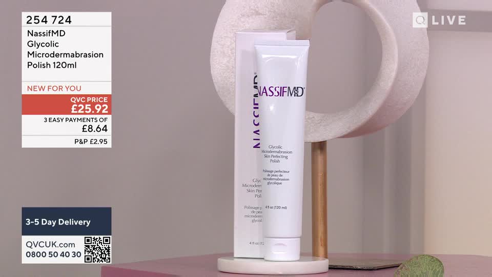A white tube of NassifMD Glycolic Microdermabrasion Polish stands upright next to its box, both resting on a pink surface. The QVC price and delivery details are displayed in the corner of the screen, promoting the product.
