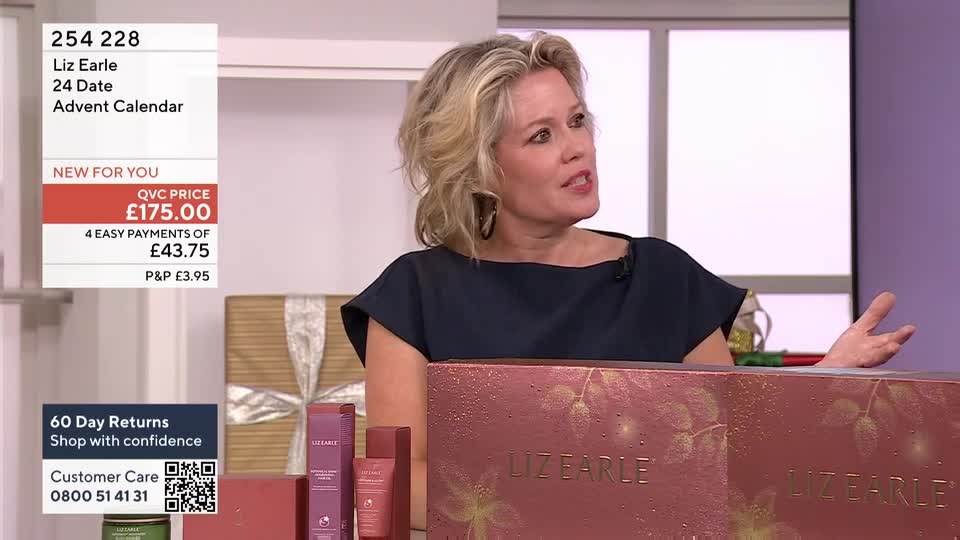 A woman in a dark top gestures with her hands as she speaks, gesturing toward a large, decorated box. The box, emblazoned with "Liz Earle," sits on a table alongside smaller product boxes.
A woman in a dark top gestures with her hands as she speaks, gesturing toward a large, decorated box. The box, emblazoned with "Liz Earle," sits on a table alongside smaller product boxes.