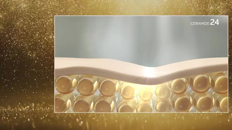 Inside a frame, a cross-section of skin is shown, with tiny, golden spheres beneath the surface. Light bursts from the spheres, as if they're releasing something.
Inside a frame, a cross-section of skin is shown, with tiny, golden spheres beneath the surface. Light bursts from the spheres, as if they're releasing something.