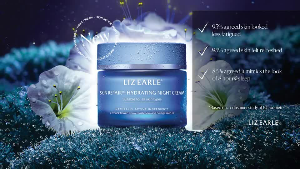 A jar of Liz Earle Skin Repair Hydrating Night Cream sits amongst dew-kissed white flowers. The blue packaging, glistening with water droplets, is illuminated by soft light. A jar of Liz Earle Skin Repair Hydrating Night Cream sits amongst dew-kissed white flowers. The blue packaging, glistening with water droplets, is illuminated by soft light.
