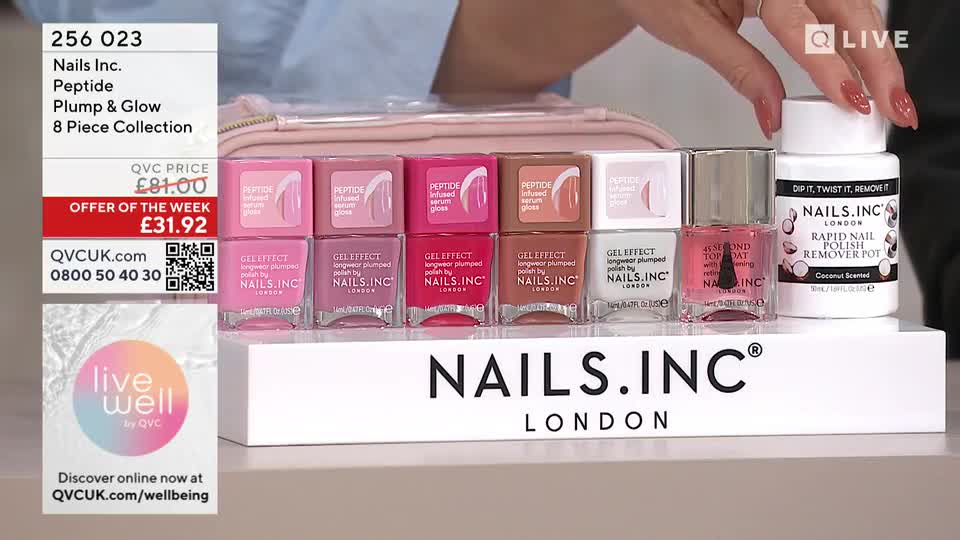 A hand with perfectly manicured nails reaches for a white pot labeled "Rapid Nail Polish Remover Pot." Beside it, a row of eight small bottles of Nails Inc. polish stand in shades of pink and nude.