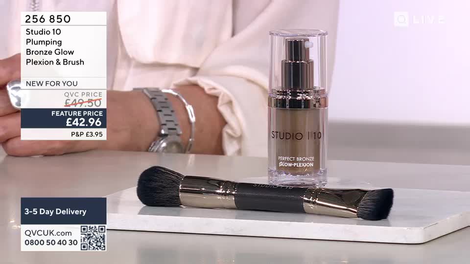 A bottle of Studio 10 Perfect Bronze Glow-Plexion sits next to a dual-ended brush. The QVC beauty product is displayed on a white surface.