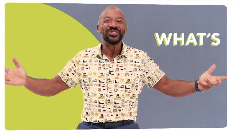 A man with a wide smile gestures with both hands, his patterned shirt catching the light. The word "WHAT'S" appears in bold white letters beside him.
