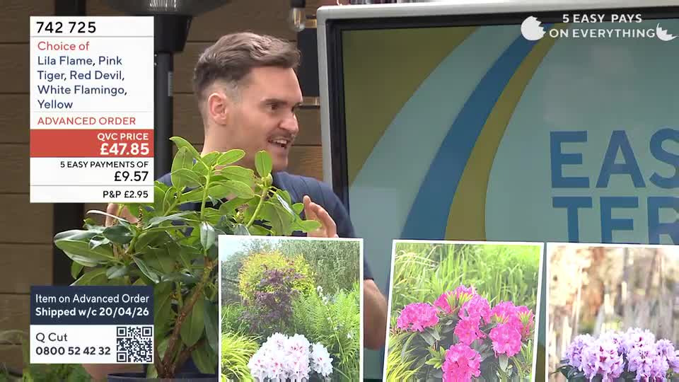 A man on QVC Extra holds a leafy green plant, gesturing enthusiastically. On the screen behind him, the word "EASTER" is partially visible, alongside colourful images of rhododendrons.