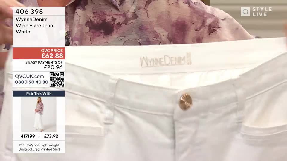 The presenter is holding up a pair of white jeans, showing the waistband and button. The WynneDenim logo is visible just below the presenter's chin.
