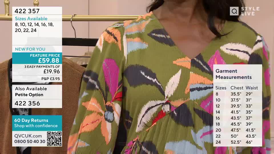 A woman in a floral dress stands in front of a rack of clothes, the garment's price and measurements displayed on the screen. The dress has a V-neck and long sleeves, and the pattern includes orange, pink, and grey shapes on a green background.
