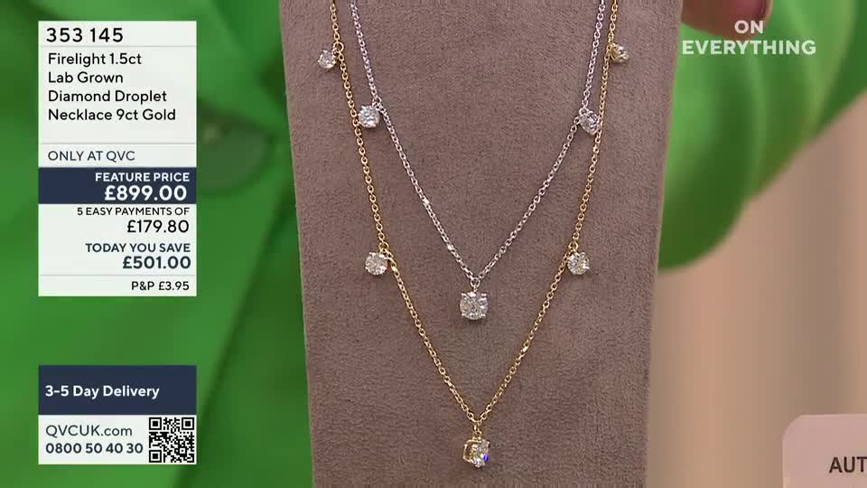 Two diamond necklaces, one gold and one silver, hang against a neutral backdrop. The price and details flash on the screen, a typical QVC presentation.
