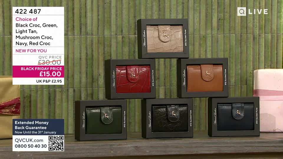 A selection of leather wallets, each in a different colour and presented in a box, are stacked in a pyramid shape. The QVC logo and a Black Friday price offer are visible in the top left corner.
A selection of leather wallets, each in a different colour and presented in a box, are stacked in a pyramid shape. The QVC logo and a Black Friday price offer are visible in the top left corner.