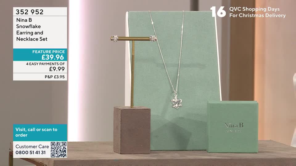 A silver necklace and matching earrings, each with a snowflake pendant, are displayed on a stand. Next to them, a small green box sits, ready for the jewelry set to be packed and delivered.
A silver necklace and matching earrings, each with a snowflake pendant, are displayed on a stand. Next to them, a small green box sits, ready for the jewelry set to be packed and delivered.