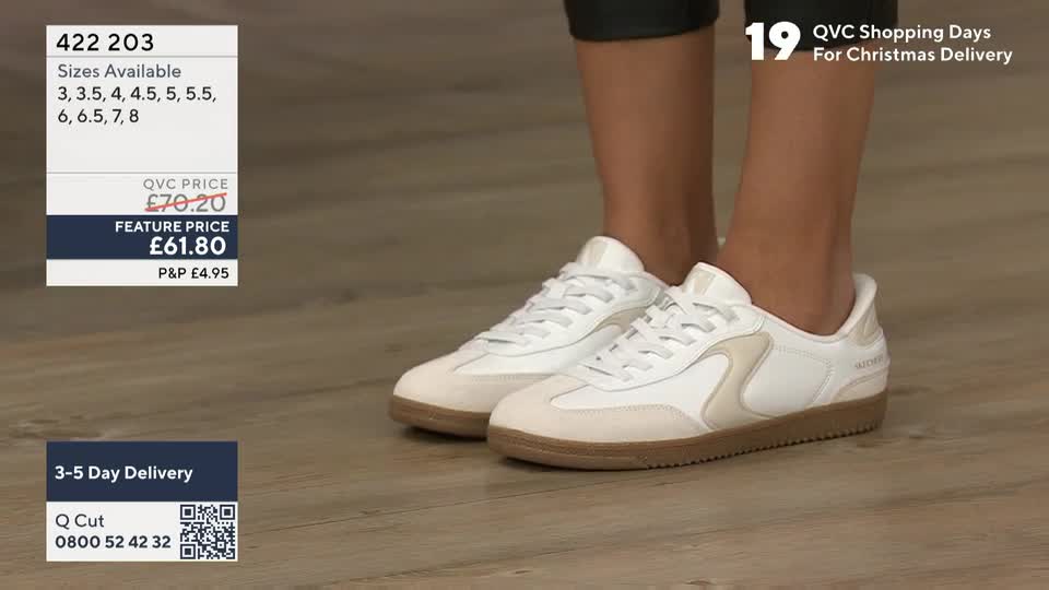 A pair of white trainers with tan soles is the focus, shown from the ankles down. The QVC price and sizes are displayed in the corner, and the presenter is likely demonstrating the shoes.
A pair of white trainers with tan soles is the focus, shown from the ankles down. The QVC price and sizes are displayed in the corner, and the presenter is likely demonstrating the shoes.
