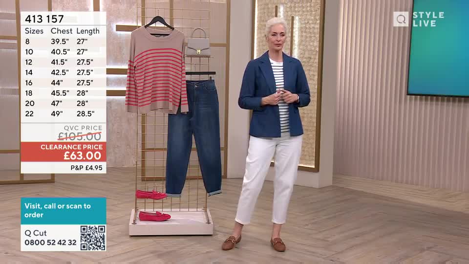 A woman in a blue blazer and white trousers stands on a polished floor, presenting a striped jumper and jeans displayed on a rack. A screen behind her shows the "Style Live" logo.
