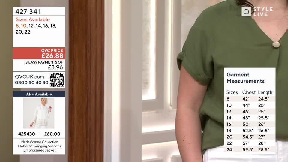 The presenter is showing off a green top with a gold button. A table of garment measurements for sizes 8 through 24 is displayed next to her.