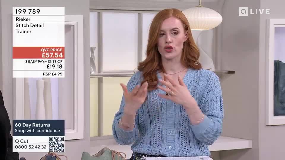 A woman with red hair gestures with her hands as she speaks. A QVC graphic displays the price of Rieker trainers.