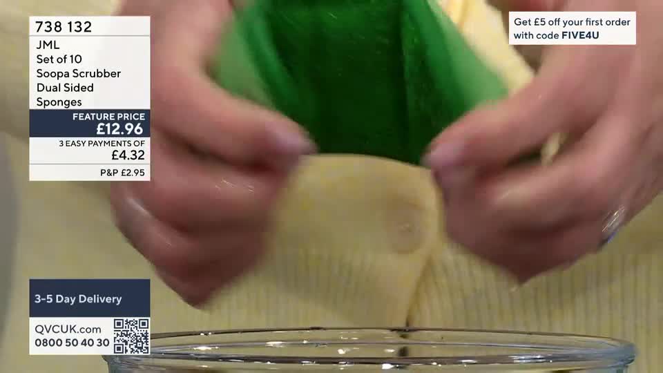 Hands are wringing out a bright green sponge over a clear bowl. The sponge is being squeezed, releasing water. Hands are wringing out a bright green sponge over a clear bowl. The sponge is being squeezed, releasing water.