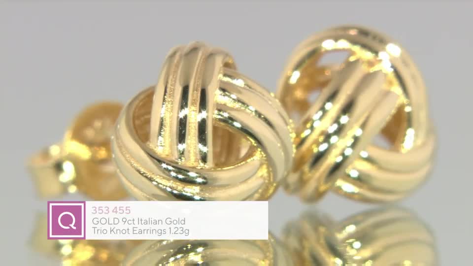 A pair of gold knot earrings sits on a reflective surface, catching the light. A QVC graphic displays the item's details: "GOLD 9ct Italian Gold Trio Knot Earrings 1.23g."