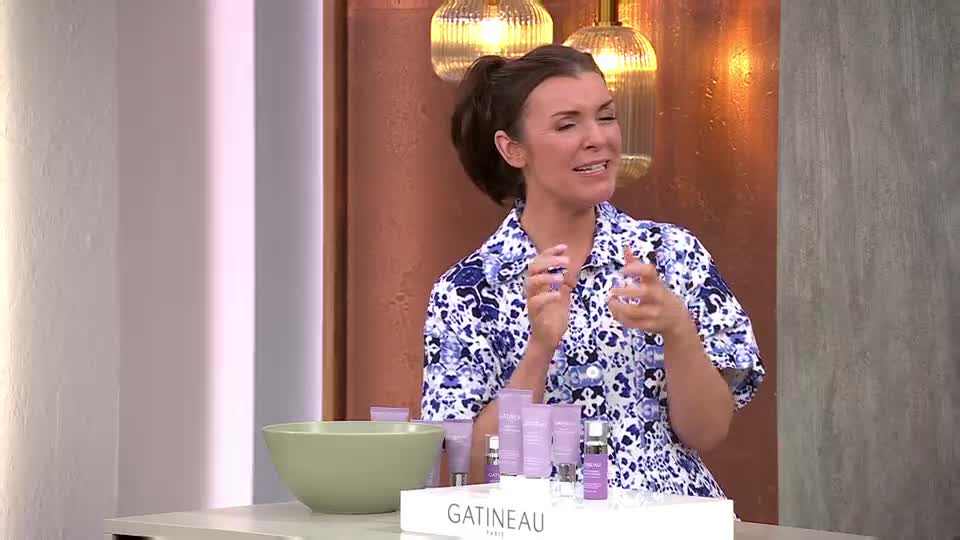 She's enthusiastically demonstrating skincare products on QVC. Bottles of Gatineau Paris line the table in front of her. She's enthusiastically demonstrating skincare products on QVC. Bottles of Gatineau Paris line the table in front of her.