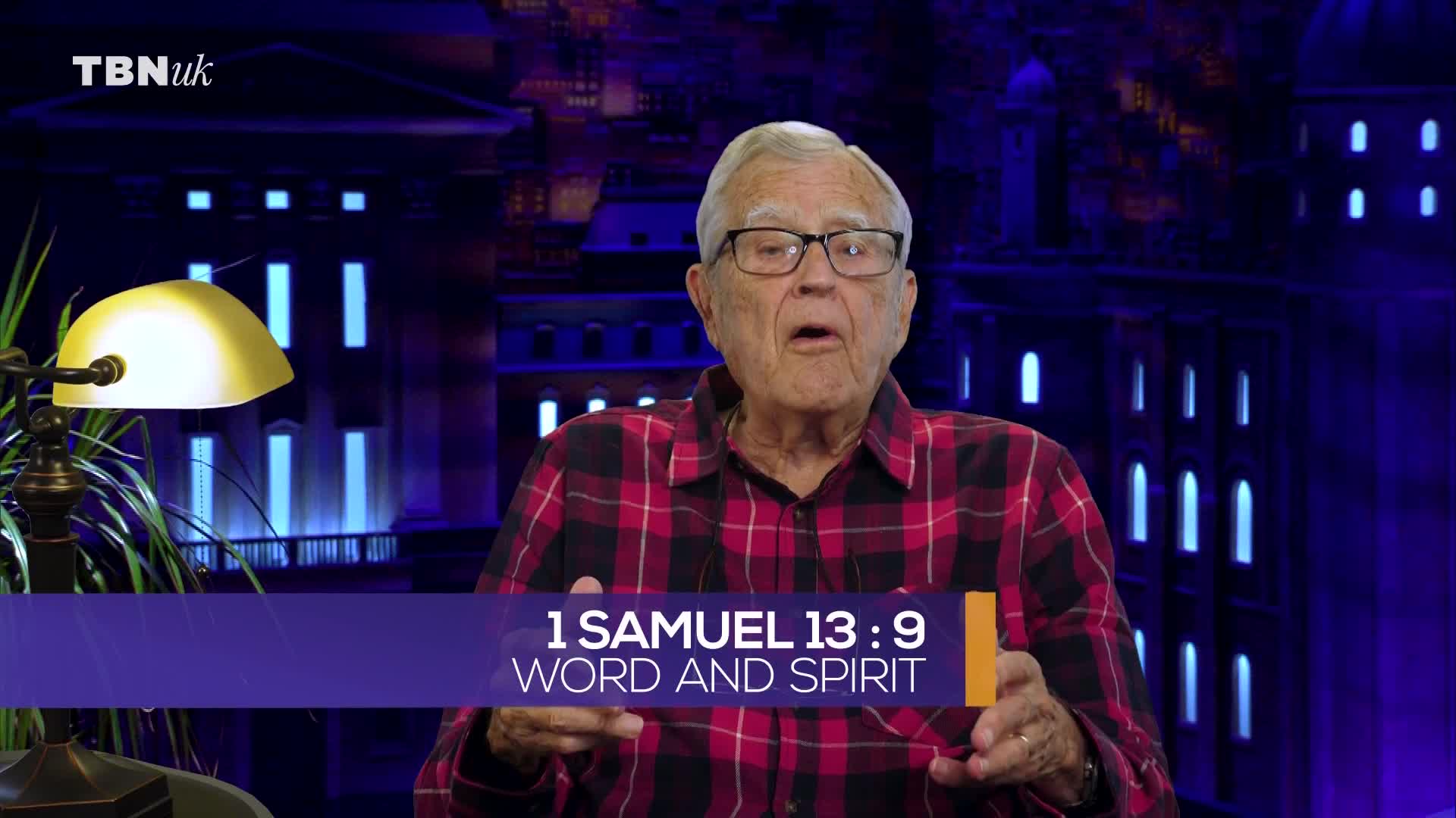 An older man in a red plaid shirt speaks with his hands, illuminated by a desk lamp. Behind him, a graphic displays "1 Samuel 13:9 Word and Spirit" with the TBN UK logo in the corner. An older man in a red plaid shirt speaks with his hands, illuminated by a desk lamp. Behind him, a graphic displays "1 Samuel 13:9 Word and Spirit" with the TBN UK logo in the corner.